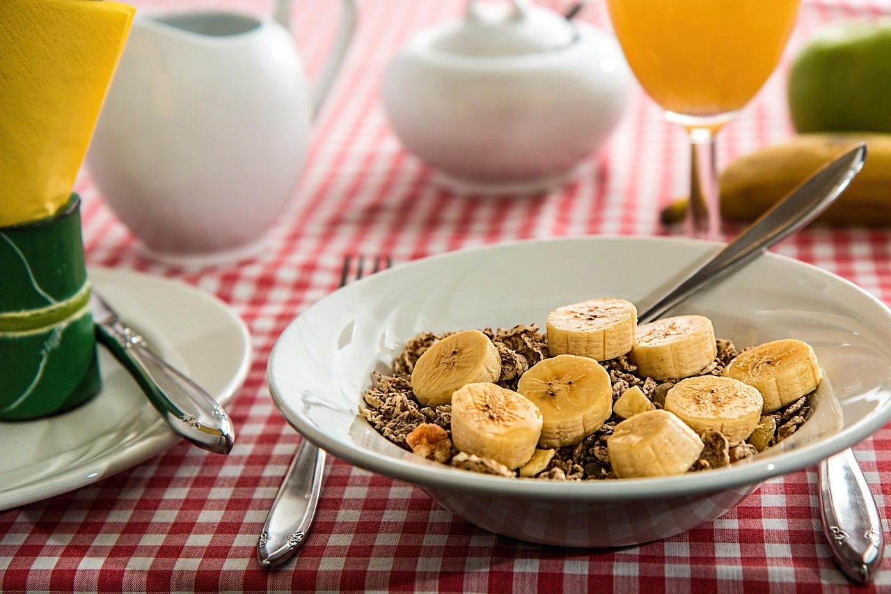 Bowl of oatmeal topped with banana and blueberries