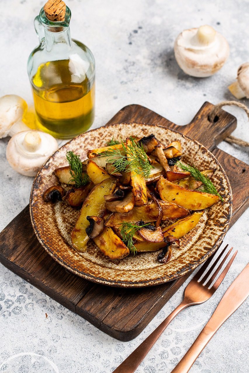 Baked sweet potato served with herbs and olive oil