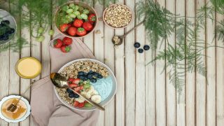 healthy breakfast after intermittent fasting with yogurt, fruits, and nuts