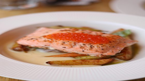 Balanced healthy plate with salmon, quinoa, and roasted vegetables for energy and nutrition